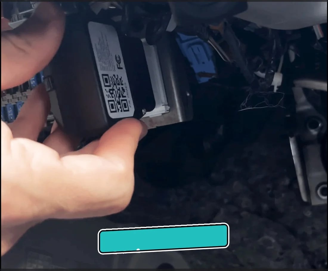 Image of an owner installing Kayo into their vehicle's OBD port.