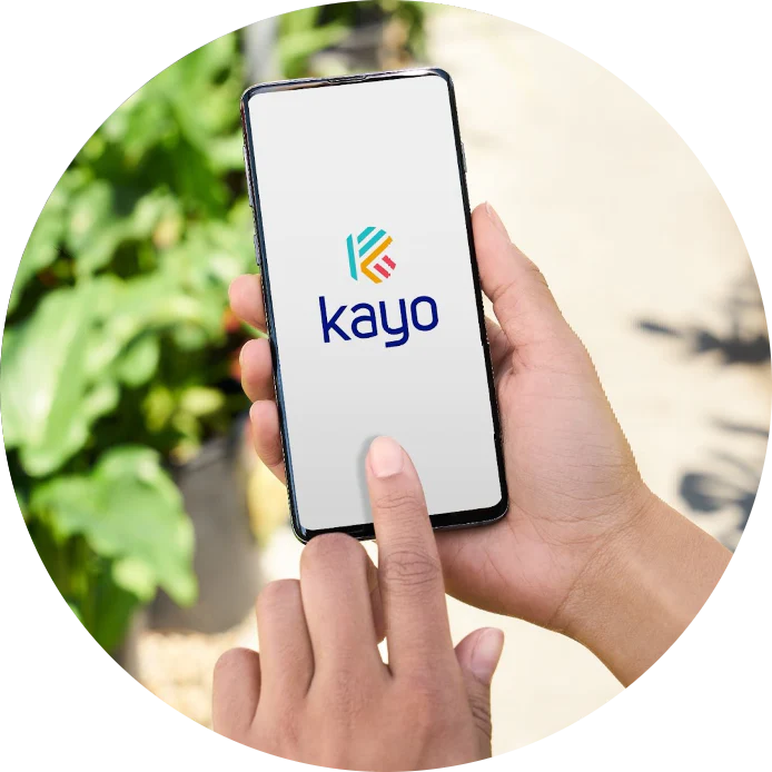 Image of a person opening the Kayo app on their smartphone.